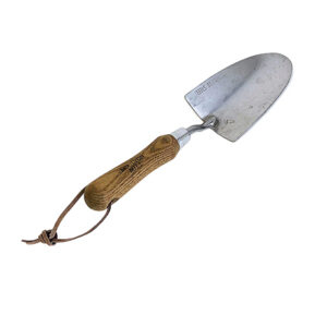 wood and silver spade with leather string